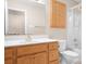 Bathroom features a shower-tub combo and a single sink with wood cabinets at 136 Barringer Dr, Statesville, NC 28625