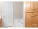 Bathroom featuring tub and cabinet for storage at 136 Barringer Dr, Statesville, NC 28625