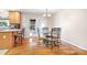 Dining area featuring hardwood floors, a chandelier, and a table with seating for four at 136 Barringer Dr, Statesville, NC 28625