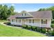 Attractive single-Gathering home with a cozy front porch, manicured shrubs, and lush green lawn at 136 Barringer Dr, Statesville, NC 28625