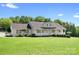Charming single-story home featuring a welcoming front porch and beautifully landscaped front yard at 136 Barringer Dr, Statesville, NC 28625