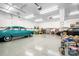 Expansive garage featuring vehicles, storage, overhead lighting, and a clean, well-maintained floor at 136 Barringer Dr, Statesville, NC 28625