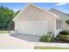 Attached two-car garage adjacent to green area and additional outdoor features at 136 Barringer Dr, Statesville, NC 28625