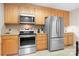 Kitchen features stainless steel appliances, stove, microwave, and refrigerator at 136 Barringer Dr, Statesville, NC 28625