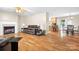 Open-concept living room with fireplace flowing into the dining area and kitchen at 136 Barringer Dr, Statesville, NC 28625
