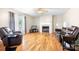 Cozy living room with hardwood floors, fireplace, and comfortable leather seating at 136 Barringer Dr, Statesville, NC 28625