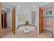Well-lit bathroom features a soaking tub with tiled surround, adding a spa-like retreat to the home at 145 Hunters Pointe Ln, Mooresville, NC 28117