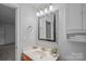 This well-lit bathroom features a modern vanity, mirror, and convenient storage for everyday use at 145 Hunters Pointe Ln, Mooresville, NC 28117