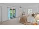 Bright bedroom with balcony access, a ceiling fan, and neutral decor provides a peaceful retreat at 145 Hunters Pointe Ln, Mooresville, NC 28117