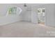 Bright bedroom featuring neutral decor and an ensuite bathroom for convenience and comfort at 145 Hunters Pointe Ln, Mooresville, NC 28117