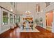 Bright dining room with a chandelier, hardwood floors, and lots of natural light at 145 Hunters Pointe Ln, Mooresville, NC 28117