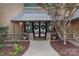 Elegant home entrance with stone accents, wreath decorated doors, and manicured landscaping at 145 Hunters Pointe Ln, Mooresville, NC 28117