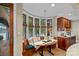 Kitchen nook features a table, bench, and a view of the water at 145 Hunters Pointe Ln, Mooresville, NC 28117
