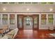 Bright living room with hardwood floors, lake views, and elegant window and door trim at 145 Hunters Pointe Ln, Mooresville, NC 28117