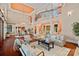 Open-concept living room features a staircase, columns, and hardwood floors at 145 Hunters Pointe Ln, Mooresville, NC 28117