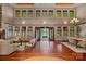 Expansive living room offering lake views, beautiful hardwood floors, and comfortable seating at 145 Hunters Pointe Ln, Mooresville, NC 28117