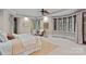 Spacious main bedroom with many windows and a seating area at 145 Hunters Pointe Ln, Mooresville, NC 28117