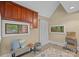 Mud room features a bench, storage baskets, and two windows at 145 Hunters Pointe Ln, Mooresville, NC 28117