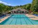 A spacious community pool with lounge chairs and a clubhouse, perfect for relaxation and recreation at 145 Hunters Pointe Ln, Mooresville, NC 28117
