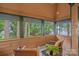 Relaxing screened porch with lake view provides a serene outdoor living space at 145 Hunters Pointe Ln, Mooresville, NC 28117