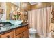 Stylish bathroom with a unique glass sink, elegant vanity, and modern fixtures at 15152 Legend Oaks Ct, Indian Land, SC 29707