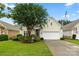 Inviting home exterior showcasing lush landscaping, a green lawn, and a well-maintained driveway at 15152 Legend Oaks Ct, Indian Land, SC 29707