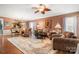Spacious living room showcasing hardwood floors, comfortable seating, and elegant decor at 15152 Legend Oaks Ct, Indian Land, SC 29707
