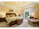 Luxurious bedroom with a king-sized bed, ample natural light, and stylish furnishings at 15152 Legend Oaks Ct, Indian Land, SC 29707