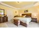 Cozy main bedroom features stylish furnishings, a decorative ceiling, and patterned wallpaper at 15152 Legend Oaks Ct, Indian Land, SC 29707