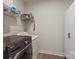 Efficient laundry room with modern washer and dryer appliances and wire shelving at 1543 Ab Moore Jr Dr, Indian Trail, NC 28079