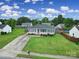 Aerial view of home with lush landscaping and a pool in the neighborhood at 1744 Marsley Ln, Rock Hill, SC 29730