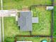 Aerial view of the backyard featuring a well-maintained lawn, privacy fence, storage shed, and patio area at 1744 Marsley Ln, Rock Hill, SC 29730