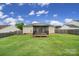 Large, well-maintained backyard features a screened-in porch for outdoor enjoyment at 1744 Marsley Ln, Rock Hill, SC 29730
