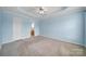 A bedroom with light blue walls, carpeted floors, and a ceiling fan at 1744 Marsley Ln, Rock Hill, SC 29730