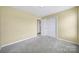 A bedroom with carpeted floors and a closet at 1744 Marsley Ln, Rock Hill, SC 29730