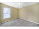 A bedroom with a window and carpeted floors at 1744 Marsley Ln, Rock Hill, SC 29730