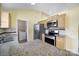 Kitchen featuring stainless steel appliances, granite countertops, and adjacent laundry area at 1744 Marsley Ln, Rock Hill, SC 29730