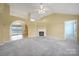 Spacious living room with fireplace and archway to dining area provides lots of light at 1744 Marsley Ln, Rock Hill, SC 29730