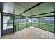 View of the screened patio with wood floors and backyard at 1744 Marsley Ln, Rock Hill, SC 29730