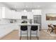 Well-lit kitchen featuring white cabinetry, a center island, and modern appliances for a sleek, functional design at 1815 Wildwood Dr, Charlotte, NC 28214