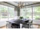 Bright dining room filled with natural light, showcasing a large table, modern lighting, and statement wallpaper at 1833 The Plz, Charlotte, NC 28205