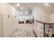 Hallway boasts a play area with a whimsical rug, costume storage, and neutral walls at 1833 The Plz, Charlotte, NC 28205