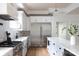 Bright kitchen featuring stainless steel appliances, quartz countertops, and ample cabinet space at 1833 The Plz, Charlotte, NC 28205