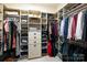 Spacious walk-in closet with custom shelving and ample storage for clothes and accessories in a bright space at 1833 The Plz, Charlotte, NC 28205