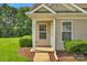 Inviting front entrance with decorative door, trimmed shrubbery and manicured lawn at 1907 Sandal Brook Rd, Fort Mill, SC 29707