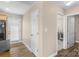 Hallway with access to the exterior door on the left, the sewing room straight ahead, and the laundry room on the right at 1907 Sandal Brook Rd, Fort Mill, SC 29707