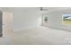 Spacious primary bedroom features neutral carpet, white walls, and two windows at 198 Wrangell Dr, Mooresville, NC 28117