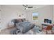 Bright bedroom featuring a ceiling fan, stylish decor, and a window with natural light at 198 Wrangell Dr, Mooresville, NC 28117