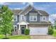 Charming two-story home with a two-car garage, stone accents, and well-maintained landscaping at 198 Wrangell Dr, Mooresville, NC 28117
