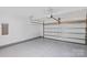Spacious garage with epoxy flooring, a garage door opener, and plenty of room for vehicles and storage at 198 Wrangell Dr, Mooresville, NC 28117